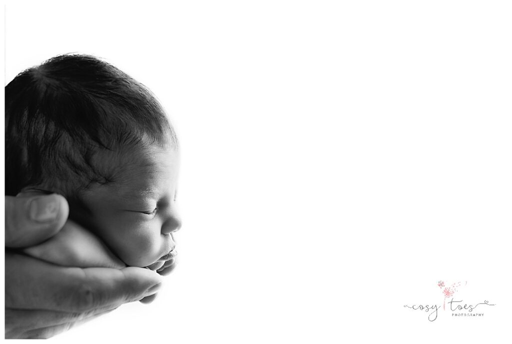 Newborn in dads hands