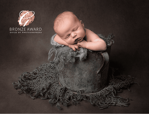 Bronze award winning photo of baby in bucket surrounded by soft fabric by Haywards Heath fabric
