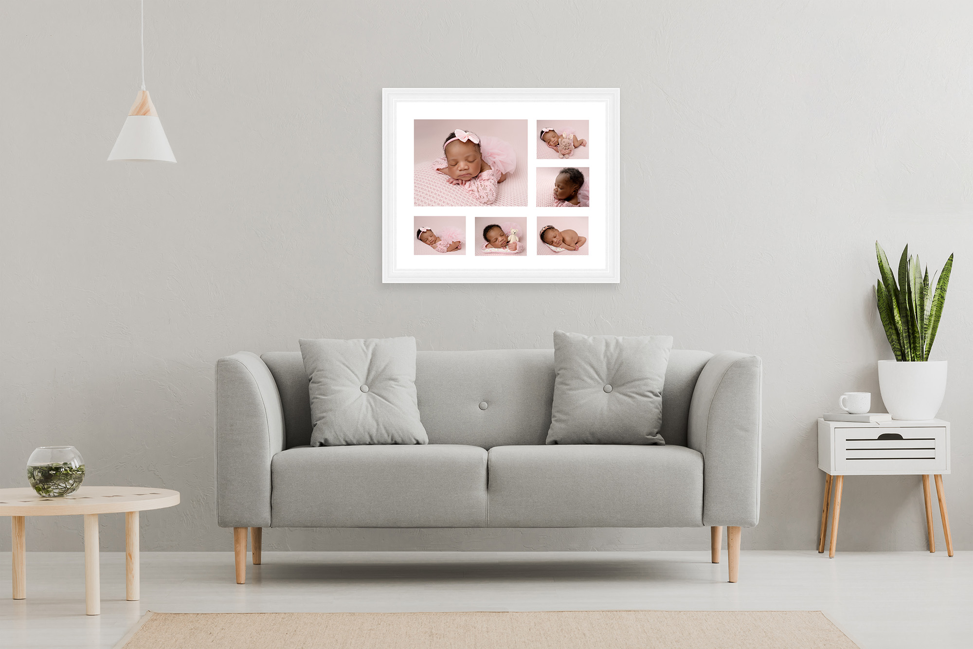 White Multi Aperture frame with newborn baby images hanging over a grey sofa in a modern living room