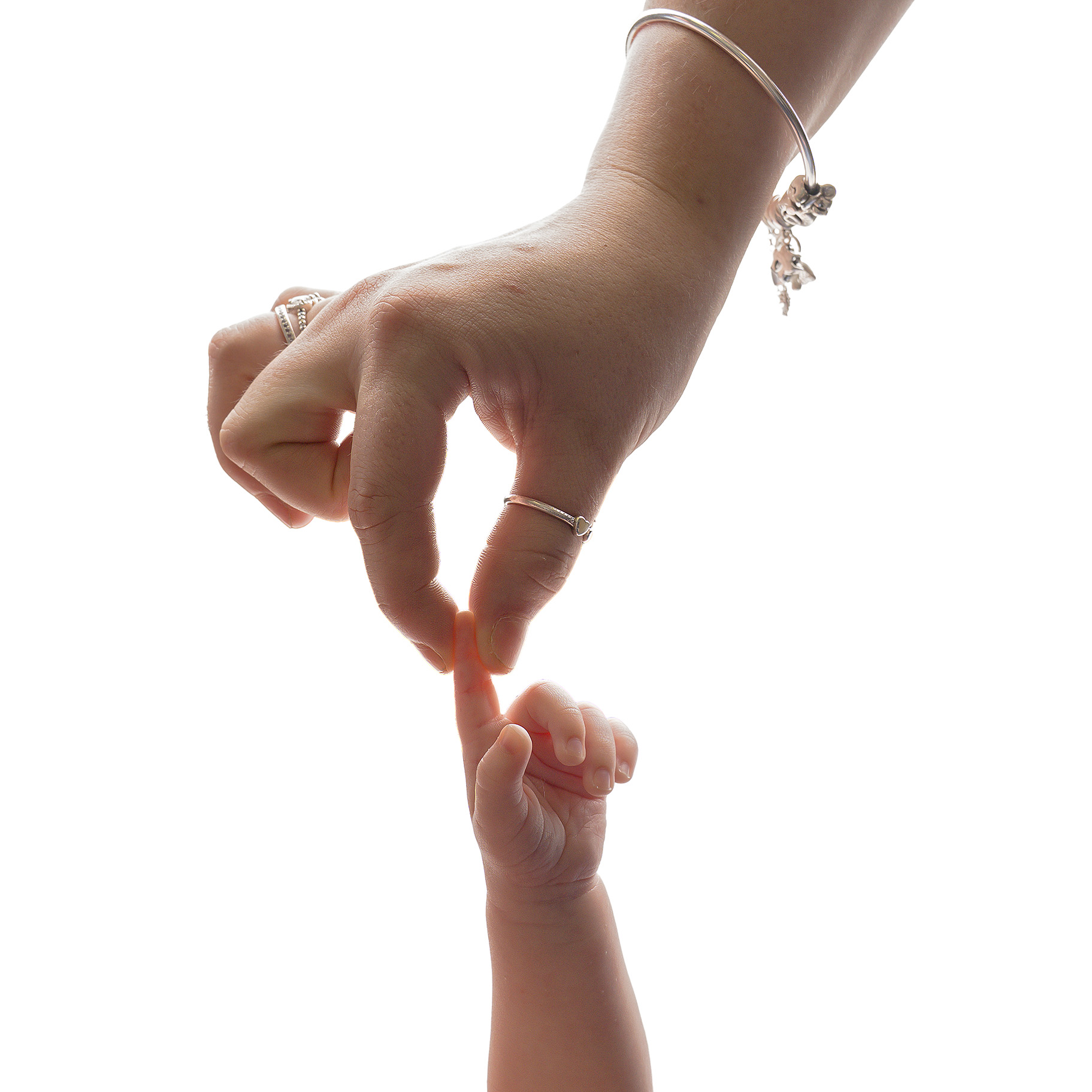 Close up of mum holding newborn baby finger by newborn photography studio near Horsham